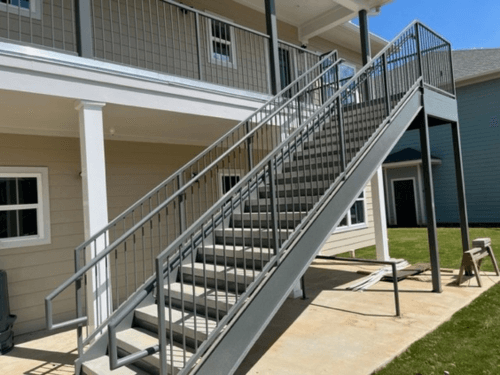 outside view of apartment complex stairs that lead to the second floor