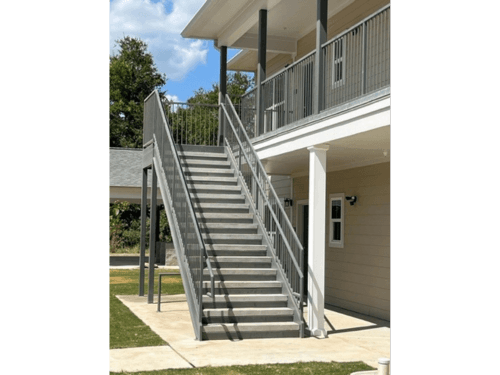 Stairs at an apartment complex that lead to the second floor.